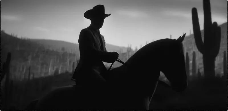 Krea 2 example: Male cowboy riding horse through the desert, close up shot